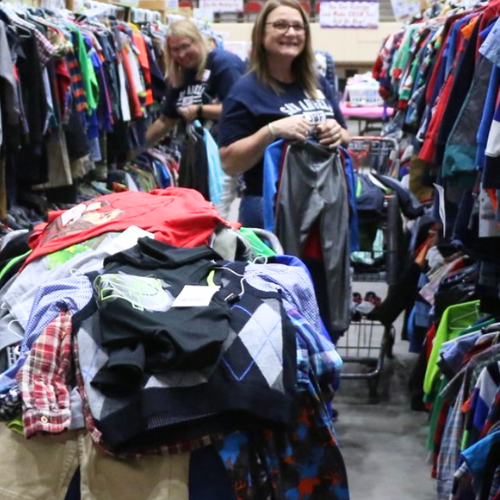 A mom shopping at a JBF event. 